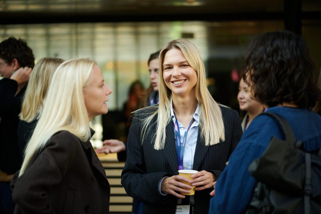 Women networking at a Baltic startup and venture capital event in 2026.